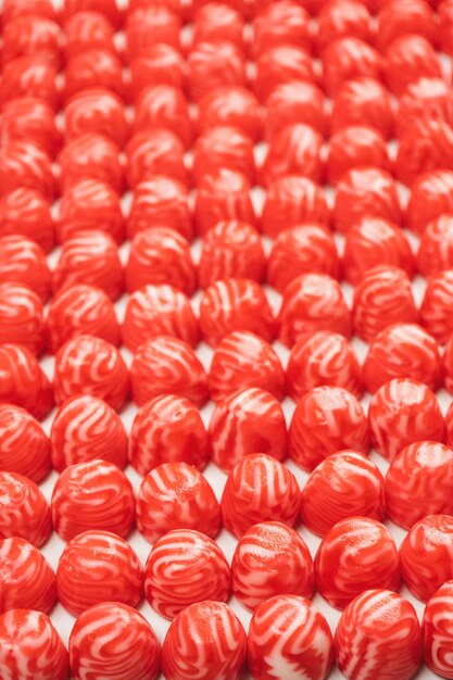 Red round tasty gummy candies as a background