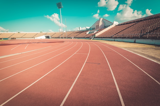 Photo red running track in stadium , vintage