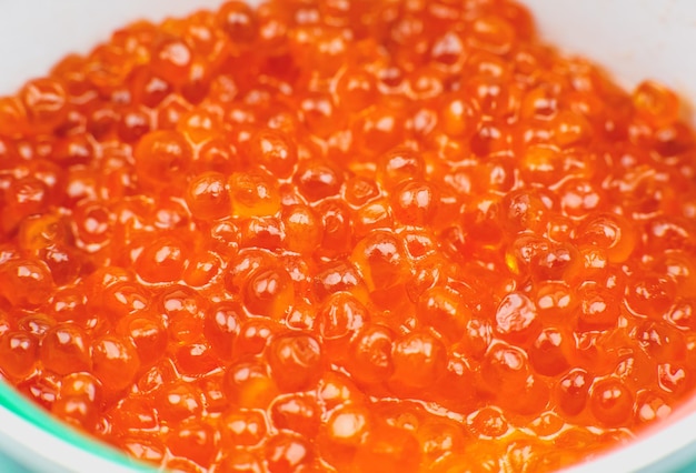 Red salmon caviar background Luxury delicacy seafood Close up