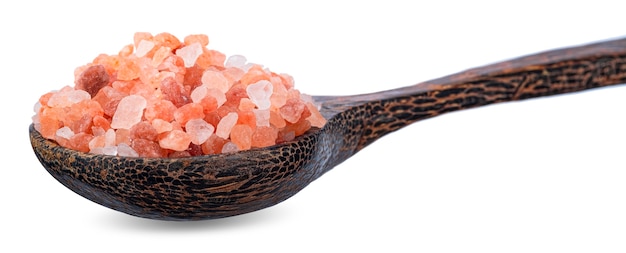 Red salt on wooden spoon isolated on white