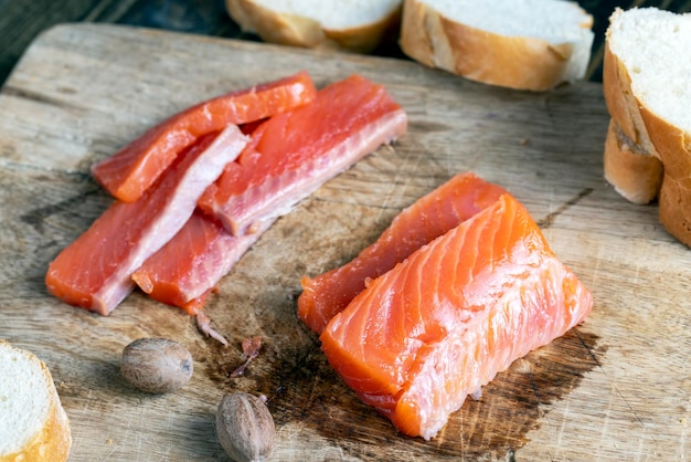 Red salted salmon fish meat on a chopping board salted salmon fish that is used for sushi and other Asian dishes