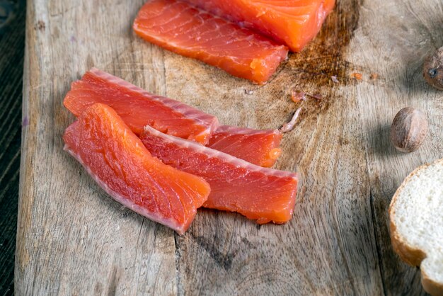 Red salted salmon fish meat on a chopping board salted salmon fish that is used for sushi and other Asian dishes