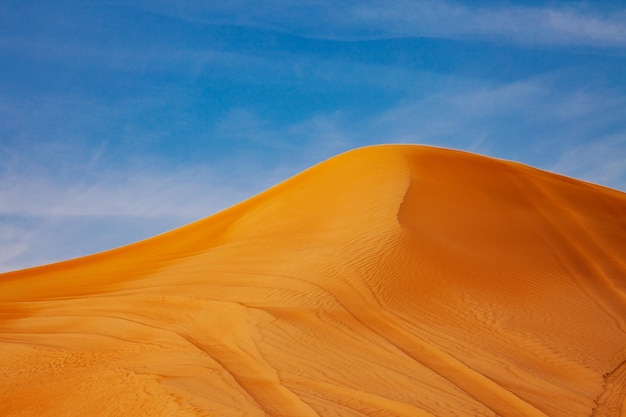 Red Sand Desert Barchan and Blue Sky Lanscape