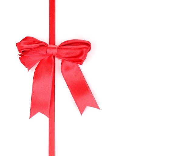 Red satin bow and ribbon isolated on white