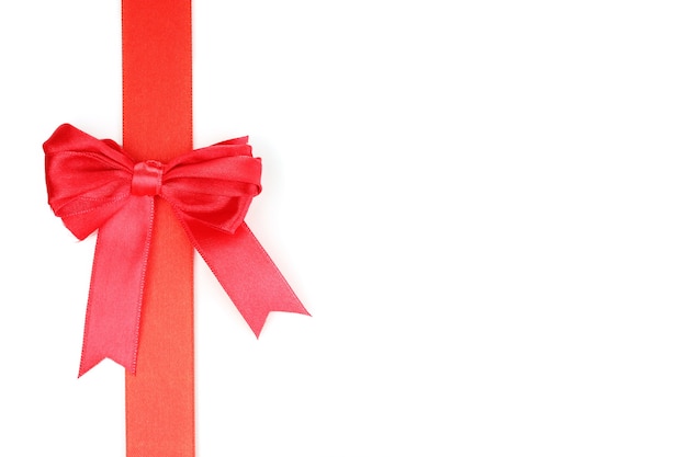 Red satin bow and ribbon isolated on white