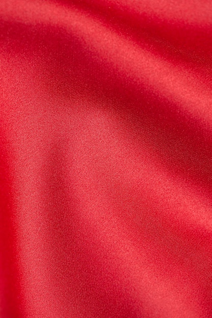 Red satin fabric background Copy space Vertical photo