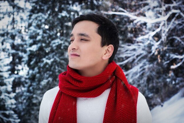 Red scarf asian man outdoor portrait.