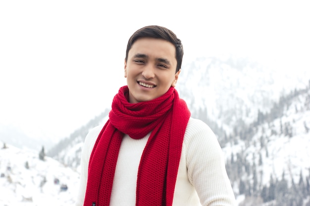 Red scarf and white sweater.