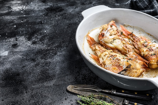 Red Sea perch or grouper baked  in a baking dish