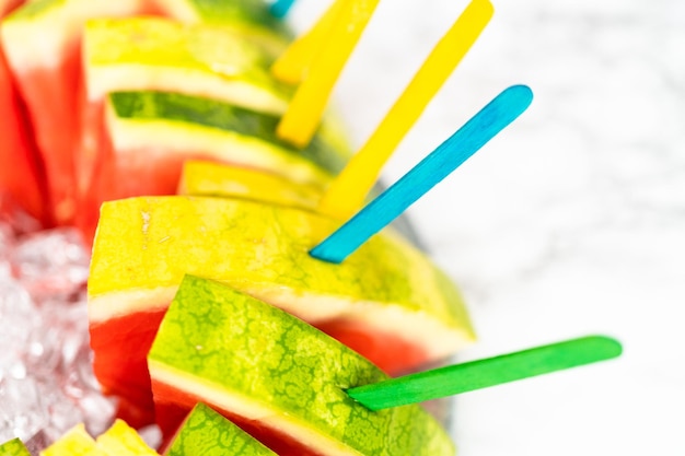 Red seedless watermelon slice popsicles for kids.