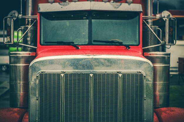 Photo red semi truck chrome grill closeup heavy duty transportation theme