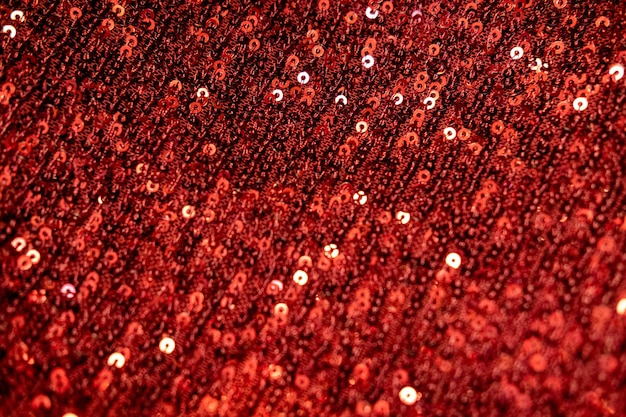 Red sequins background or texture sparkling sequined textile