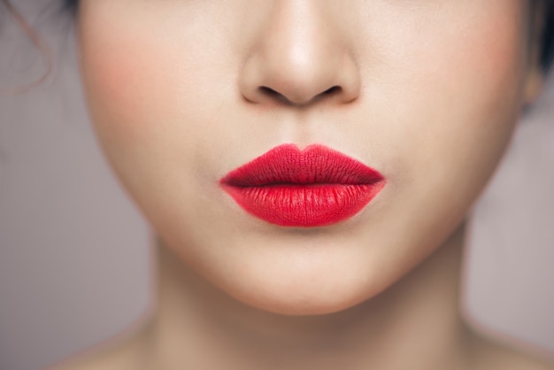 Photo red sexy lips closeup. make up concept. beautiful perfect lips.