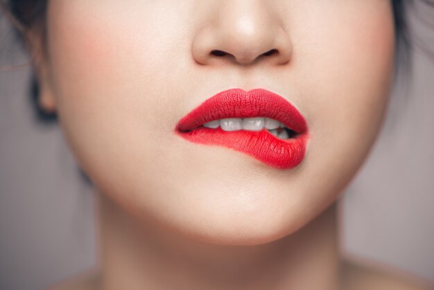 Photo red sexy lips closeup. make up concept. beautiful perfect lips.