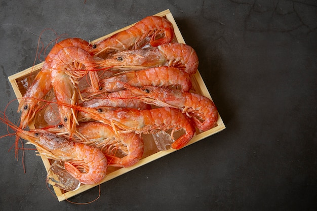 Red shrimp large in wooden box . the view from the top. Marine food