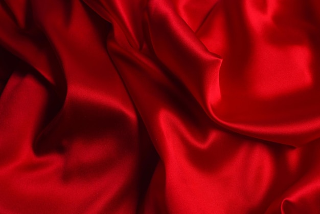 Red silk or satin luxury fabric texture can use as abstract background Top view