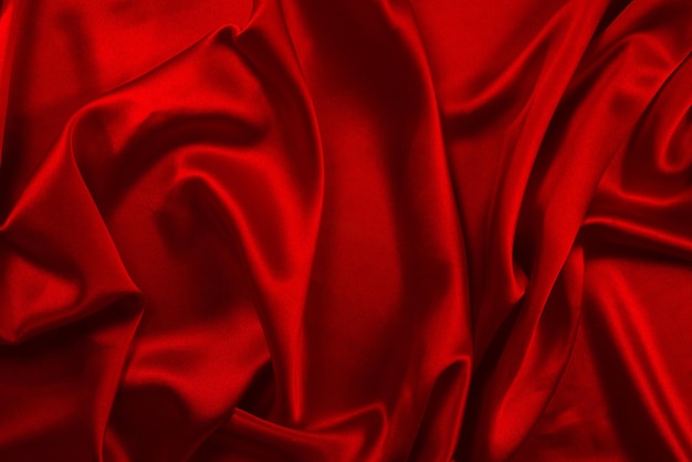 Red silk or satin luxury fabric texture can use as abstract background Top view