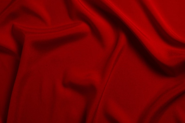 Red silk or satin luxury fabric texture can use as abstract background Top view