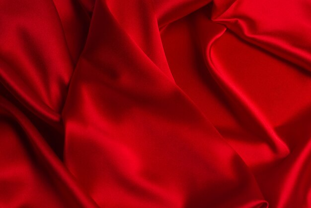 Red silk or satin luxury fabric texture can use as abstract background.