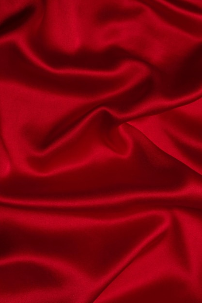 Red silk or satin luxury fabric texture can use as abstract background