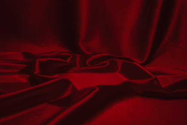 Red silk or satin luxury fabric texture can use as abstract.