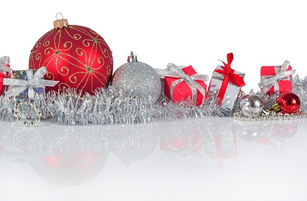 Red and silver Christmas decorations on a white background