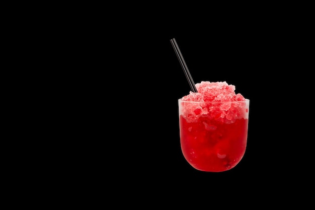 Red Slush drink isolated on black background Glass of Shaved ice Granizado with Fruit juice