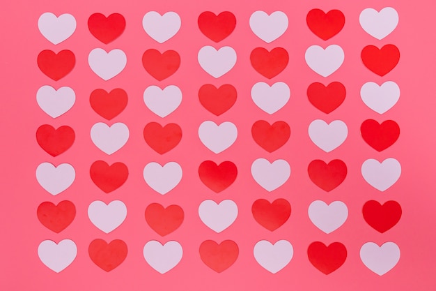 red small hearts pattern on pink