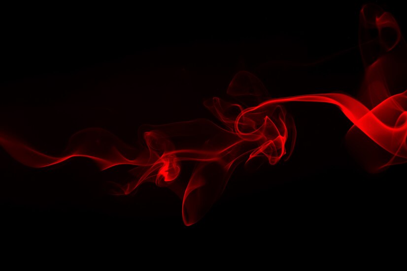 Premium Photo | Red smoke abstract on black background. fire design
