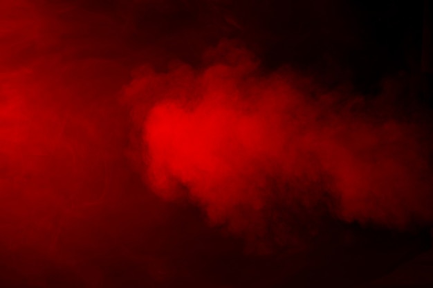 Red smoke on black background