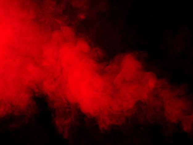 Red smoke on black background