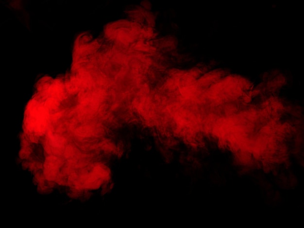 Red smoke on black background