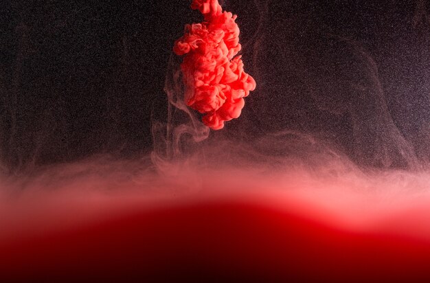 Red smoke on a dark background