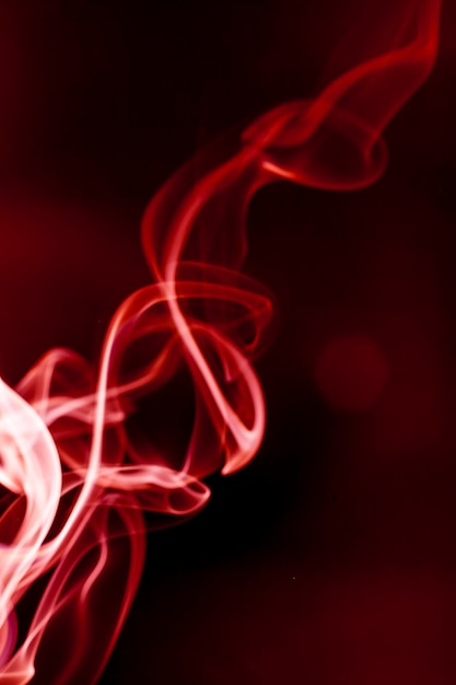 Red smoke motion on black background.