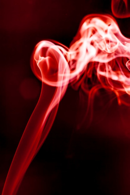 Red smoke motion on black background.