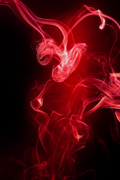 Red smoke motion on black background.