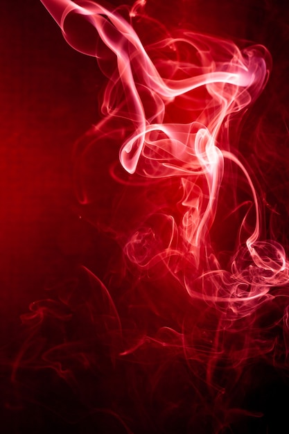 Red smoke motion on black background.