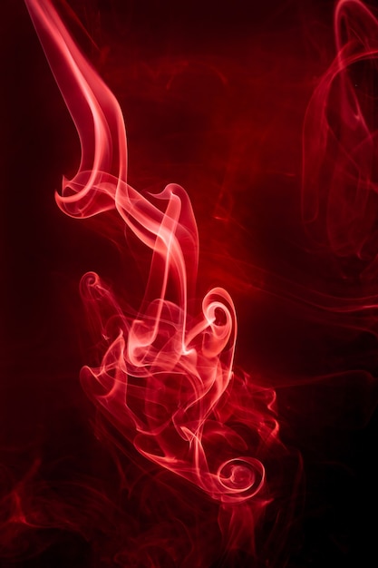 Red smoke motion on black background.