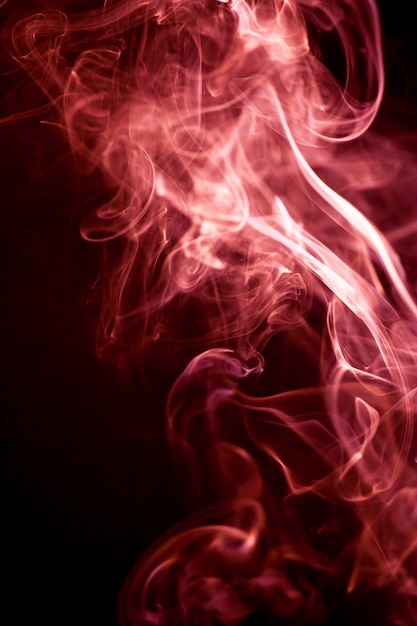 Red smoke motion on black background.