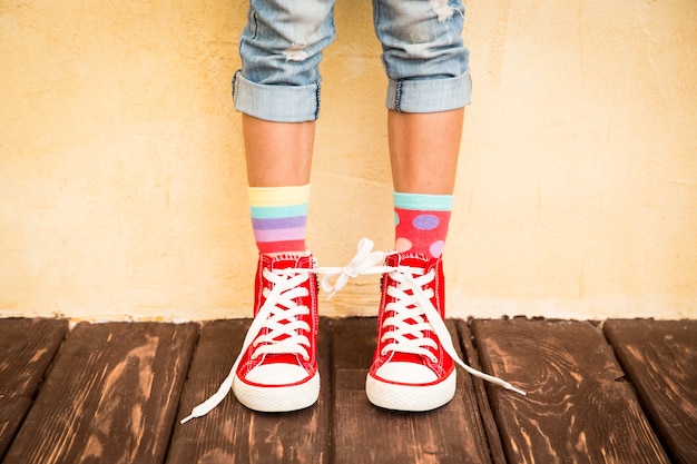 Photo red sneakers on children legs