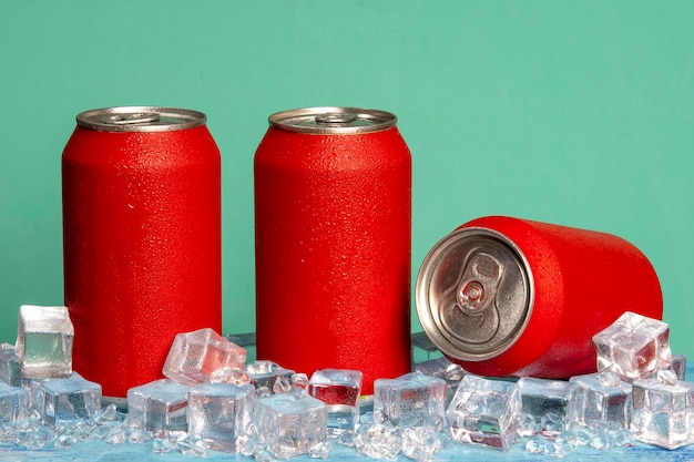 red soda can on blue background and with ice and cold