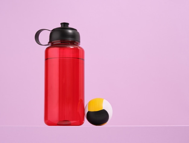 Red sport shaker and ball Various sport supplies Copy space for text