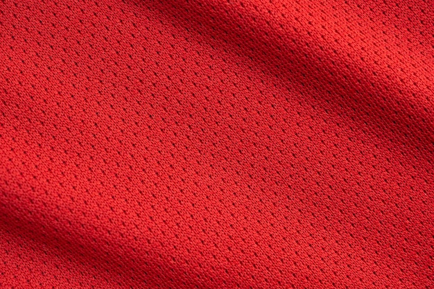 Red sports clothing fabric football jersey texture close up