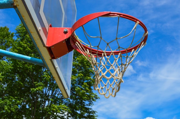 Red sports round basketball basket for playing basketball streetball on an open street area