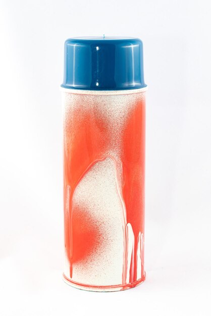Red spray paint can on white background