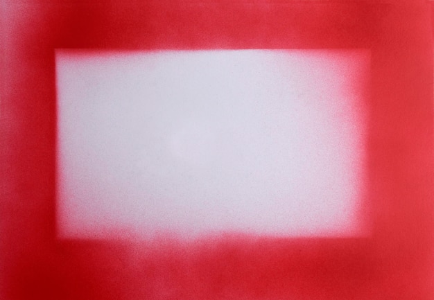 Red spray paint frame on paper