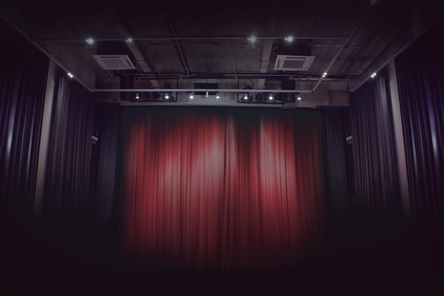 Photo red stage curtain in a small theater