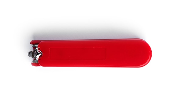 Red stapler on a white background. High quality photo