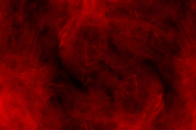 Red steam on a black background. Copy space.