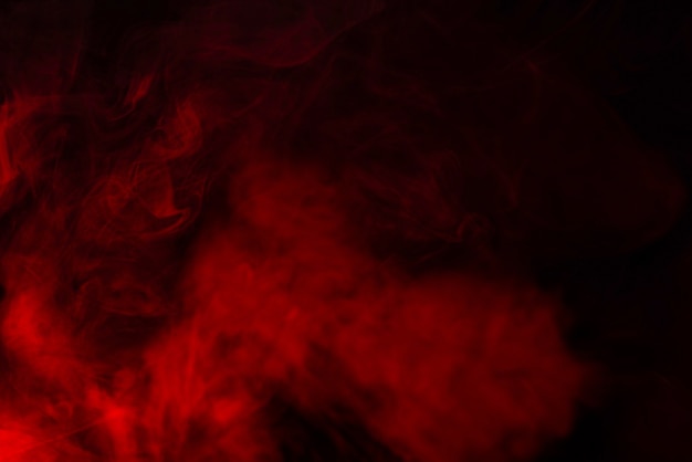 Red steam on a black background. Copy space.